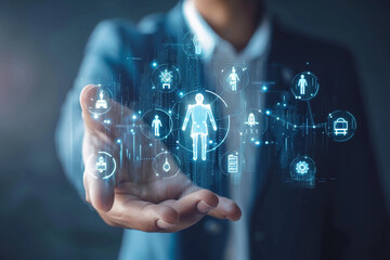 Businessman showing virtual graphic human icon for human development recruitment leadership and customer target group concept. HRM or Human Resource Management - obrazy, fototapety, plakaty