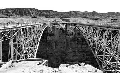 Twin spandrel arch bridges spanning over Marble Canyon and Colorado river. New and historic...
