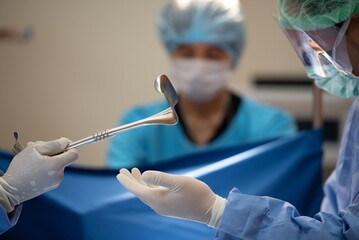 Hand of Team surgery doctor in Operating Room hold operating stretcher give to Surgeons During...