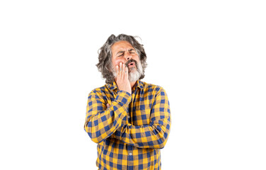 A man with a beard and a checkered shirt complains of a toothache