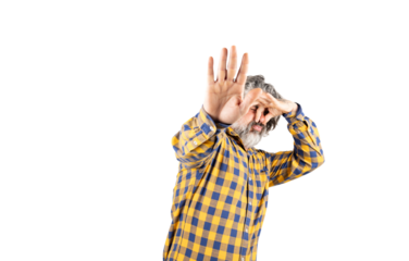 Bearded man in checkered shirt smelling something smelly and disgusting holding his breath with fingers in his nose, bad smell