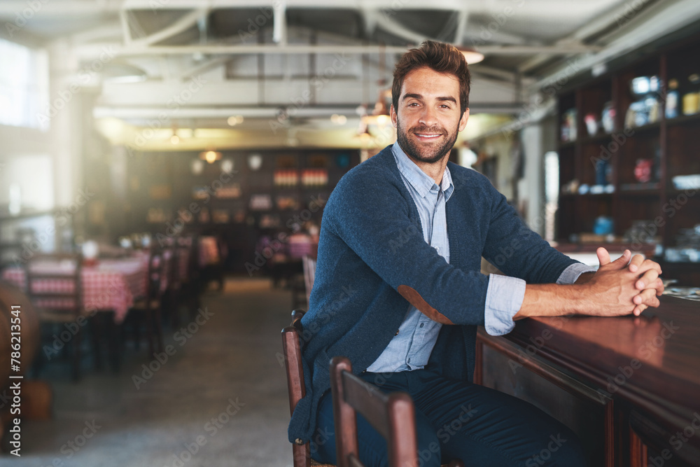 Poster Portrait, happy and business with man, pub and sitting with break and alcohol establishment. Face, person and guy with peace and relax with entrepreneur and patience with fashion, casual and counter