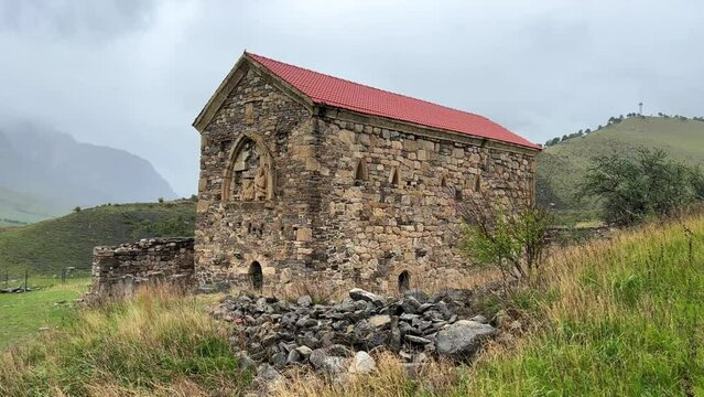 Thaba-Yerdy in Ingushetia. ZEISS, RUSSIA - MAY 19, 2023: Video of the Thaba-Yerdy Temple, the oldest temple in Ingushetia. The Caucasus Mountains. 4K