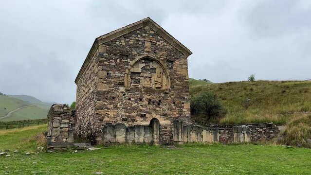 Thaba-Yerdy in Ingushetia. ZEISS, RUSSIA - MAY 19, 2023: Video of the Thaba-Yerdy Temple, the oldest temple in Ingushetia. The Caucasus Mountains. 4K