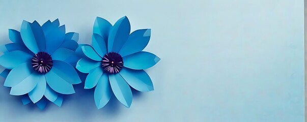 paper cut flowers with green leaves, copy space on blue background