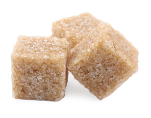 Three brown sugar cubes isolated on white