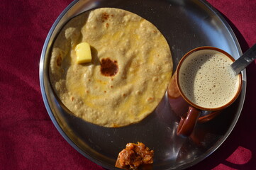 Desi breakfast chapati tea and achar food of india