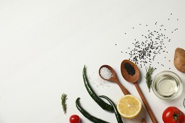 Cooking dinner. Different vegetables and spices on white wooden table, flat lay. Space for text
