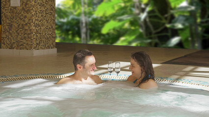 Young couple enjoy time together in the hot tub