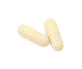 Vitamin capsules isolated on white, top view. Health supplement