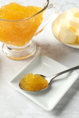 Fresh pike caviar and butter on white marble table
