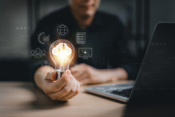 Man hand holding Light bulb Global Internet connection. Business global internet connection application technology and digital marketing, Financial and banking, Digital link tech, big data.