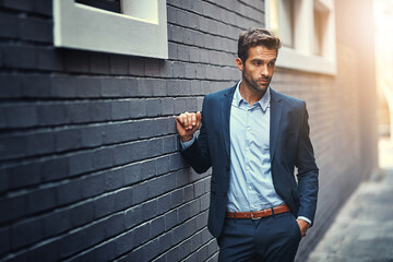 Thinking, businessman and wonder in city by wall with corporate fashion, trendy and stylish suit....
