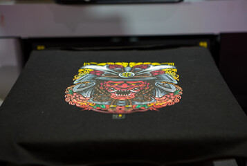 Sublimation printer printing T shirt show in Garment and Textile Manufacturing Industry.	
