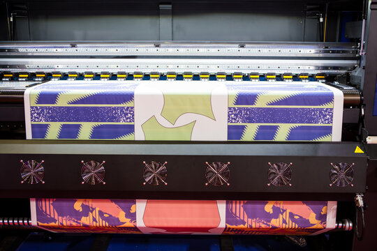 Sublimation printer printing T shirt show in Garment and Textile Manufacturing Industry.	
