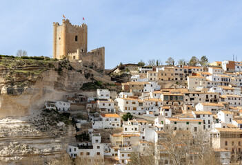 Panoramic view of the town of Alcalá del Júcar. Its popular cave houses, carved into the...