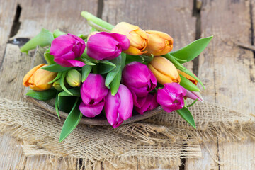 colorful tulips on wooden background - close up - 786244919