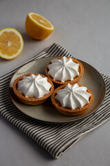 Homemade Lemon Tartlets on a Plate, side view.