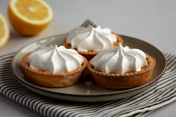 Homemade Lemon Tartlets on a Plate, low angle view. - 786247152