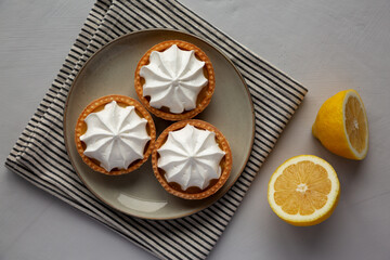 Homemade Lemon Tartlets on a Plate, top view. Flat lay, overhead, from above.