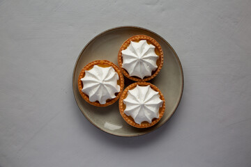 Homemade Lemon Tartlets on a Plate, top view. Flat lay, overhead, from above.