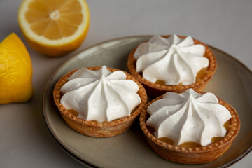 Homemade Lemon Tartlets on a Plate, side view. Close-up.