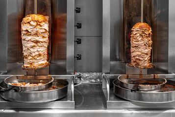 Juicy meat is fried on a shawarma spit.