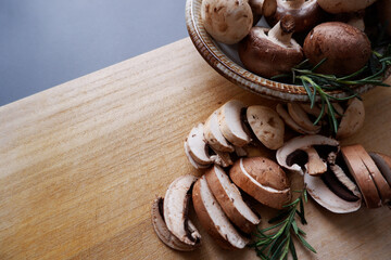 Champignon mushroom on the wooden table. healthy food concept decoration background. Mushrooms composition on wooden plate.