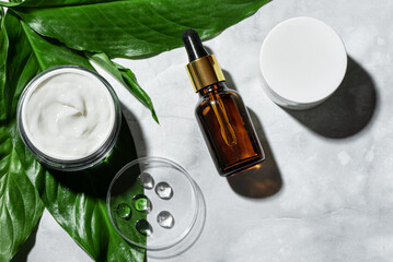 Natural cosmetics and green plant leaves