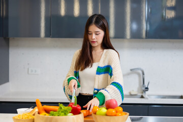 Diet lose weight and foods concept - Asian young attractive woman making fresh salad clean...