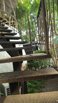 Cafe Courtyard Ascend: Outdoor Staircase Amidst Greenery