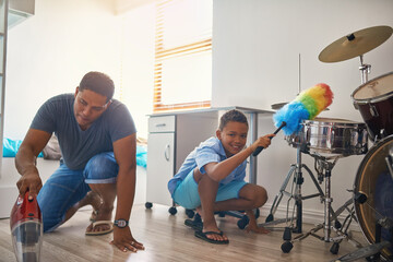 Father, portrait or child cleaning by vacuum floor of home as teamwork to learning responsibility...