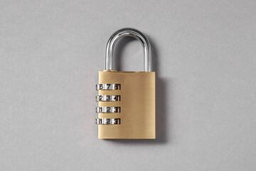 One steel combination padlock on grey background, top view
