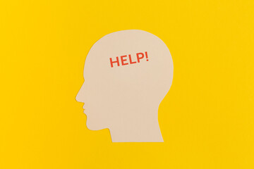 Human head with word Help on yellow background