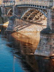 Arch bridge with reflection in water