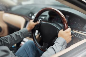 Vehicle, dashboard and hands driving for travel, holiday or roadside adventure. Person, car and...