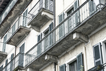Generic balconies on an old house in Italy desaturated slightly artistically - 786282712