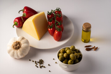 red tomatos and chilis on white