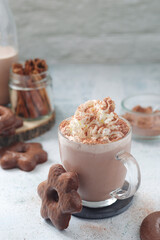 A glass mug with hot chocolate	