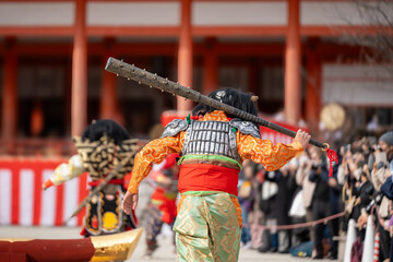 Kyoto, Japan - February 3 2024 : Heian Jingu Shrine Setsubun festival. Performers wearing an oni ( demon or ogre ) costume in the traditional Japanese shinto ritual ceremony. - obrazy, fototapety, plakaty