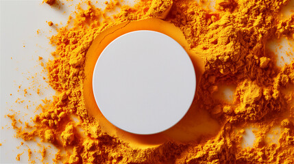 White disc with copy space on a background of turmeric spice powder 