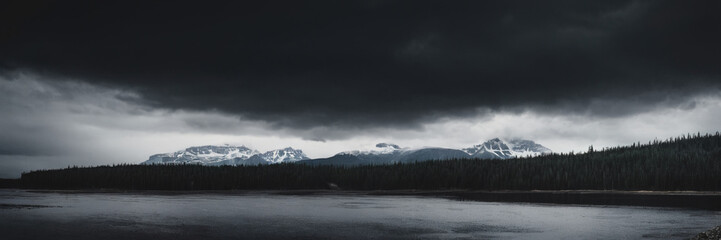 nature. cloudy nature. the gloomy forest. a lake in the mountains. grey clouds in the mountains. gloomy nature