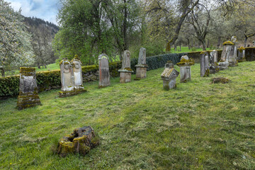 Tombstones at historical and abandoned Jewish cemetry at Lösnich Graveyard with gate with Davidstar. Rhineland-Palatinate. River Moselle area.