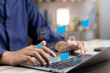 Document management system concept (DMS), Businessman working laptop virtual screen icons folder...