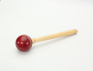 knocking ball with wooden handle isolated on white background