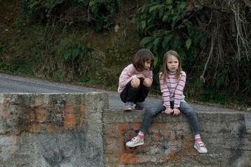 Children outdoors. Cute little girl chatting
