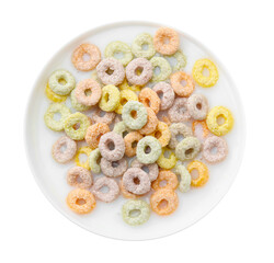 Tasty colorful cereal rings and milk in bowl isolated on white, top view