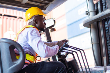 Engineer loads goods by forklift to stack containers