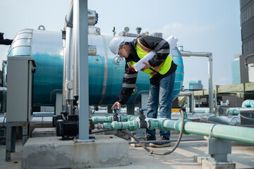 Engineer Performing Maintenance on Industrial Pipes