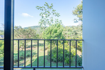 view through the window on a balcony in the jungle